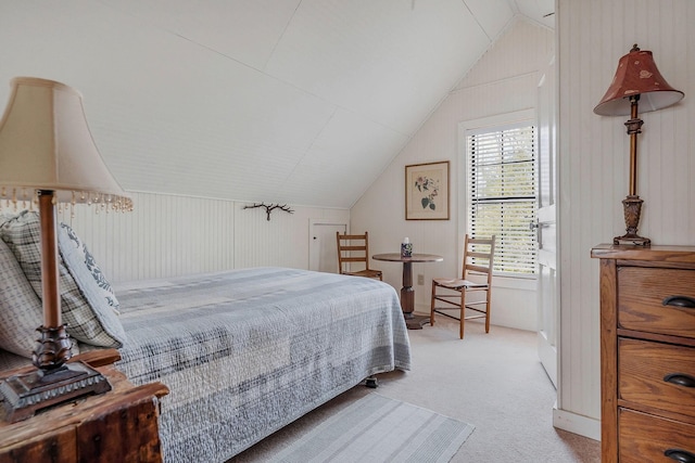 bedroom featuring lofted ceiling and light colored carpet