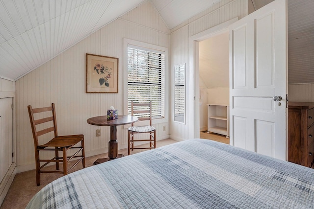 carpeted bedroom with lofted ceiling