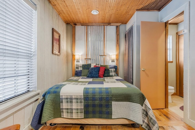 bedroom featuring wooden ceiling and light wood-type flooring