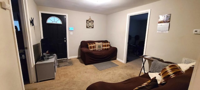 foyer with light carpet