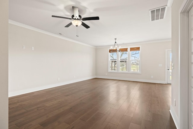 spare room with crown molding, dark hardwood / wood-style flooring, and ceiling fan with notable chandelier