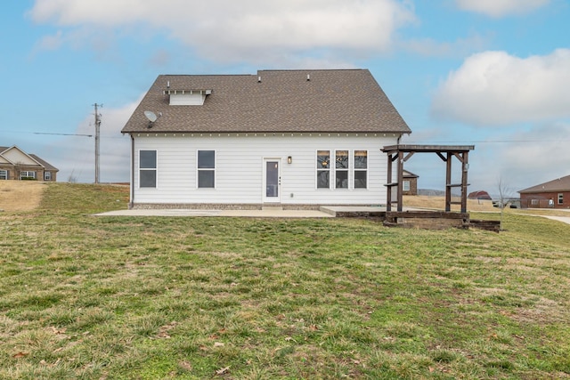 back of property featuring a pergola, a yard, and a patio