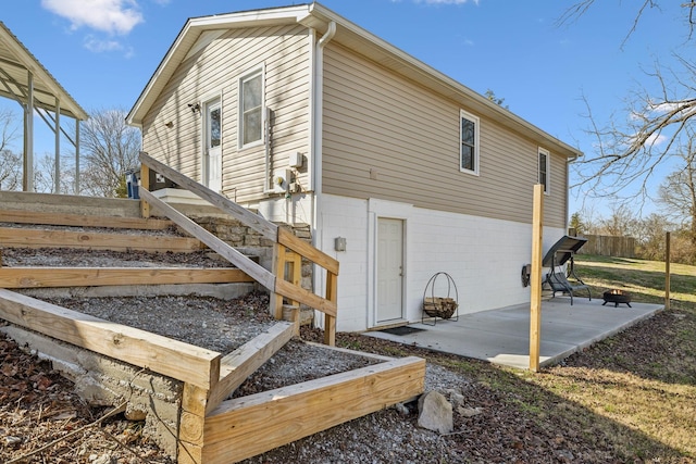 rear view of house featuring a patio