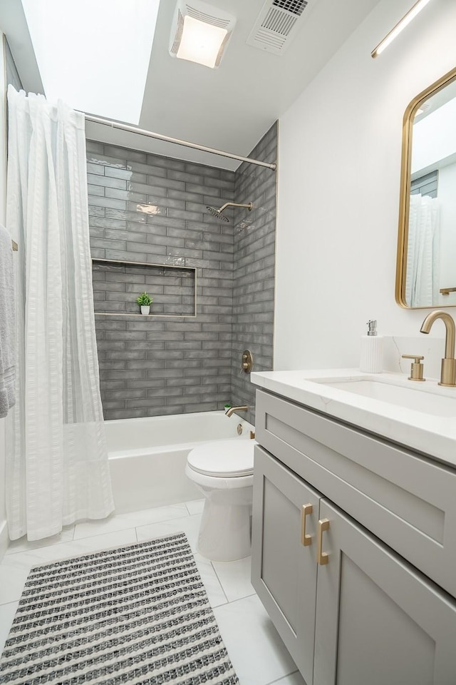 full bathroom featuring vanity, tile patterned flooring, shower / bath combination with curtain, and toilet