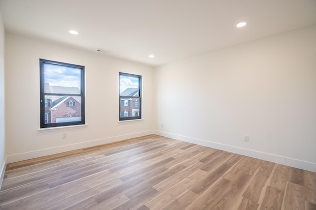 unfurnished room featuring light wood-type flooring