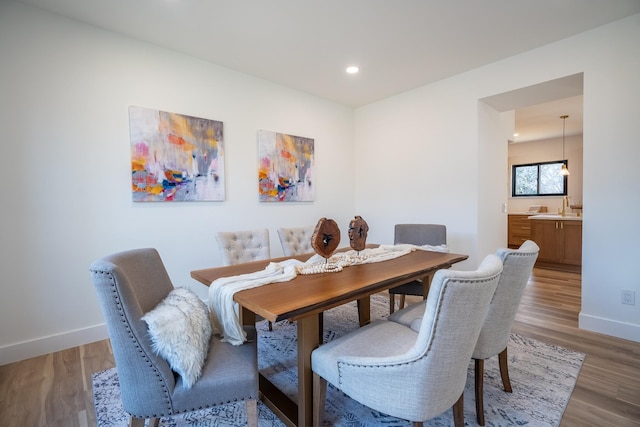 dining area featuring wood-type flooring