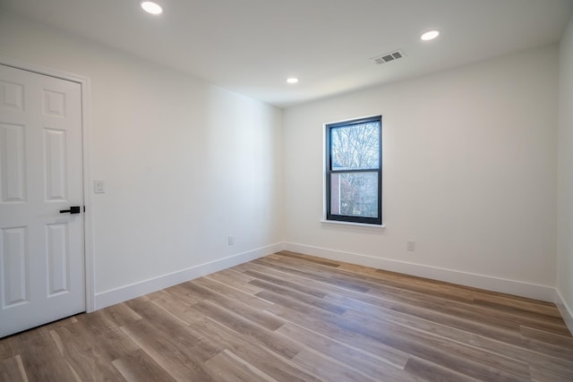 unfurnished room featuring light wood-type flooring