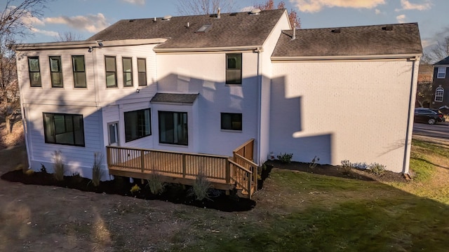 rear view of house with a wooden deck