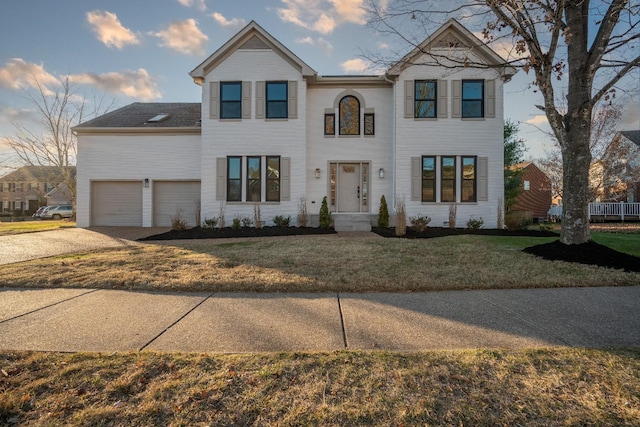 view of front of house featuring a garage and a front yard