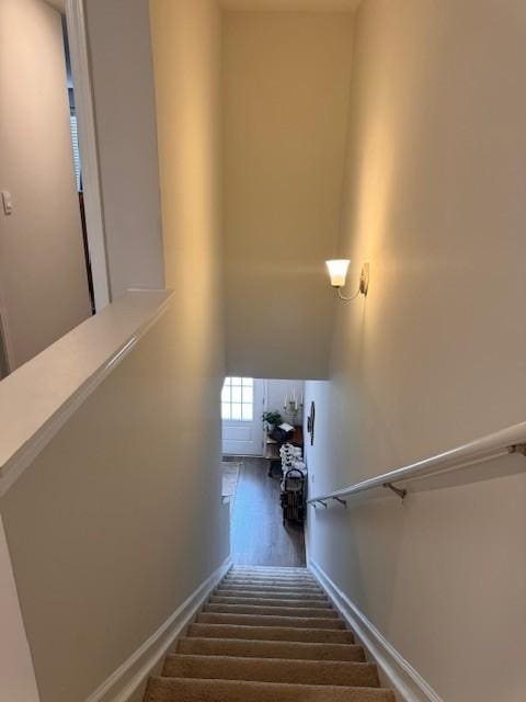 staircase featuring hardwood / wood-style flooring