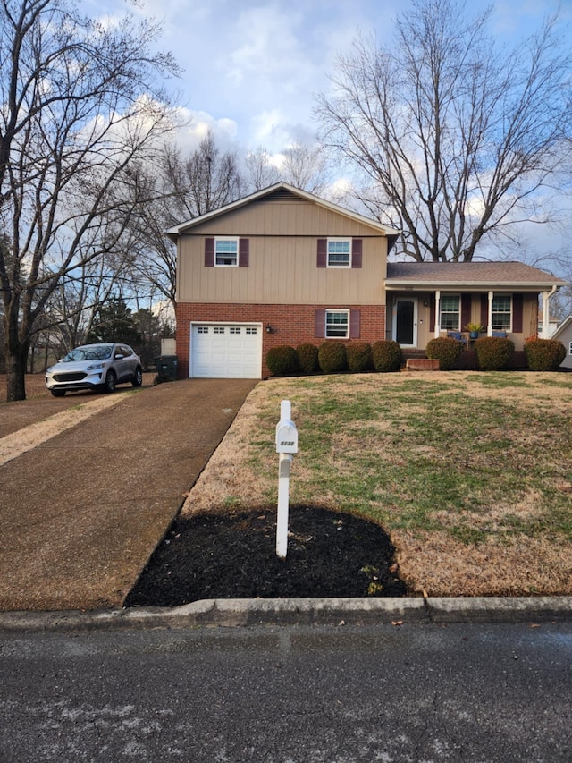 view of front of house featuring a garage and a front yard