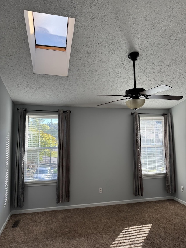 room details with carpet flooring, a textured ceiling, and ceiling fan