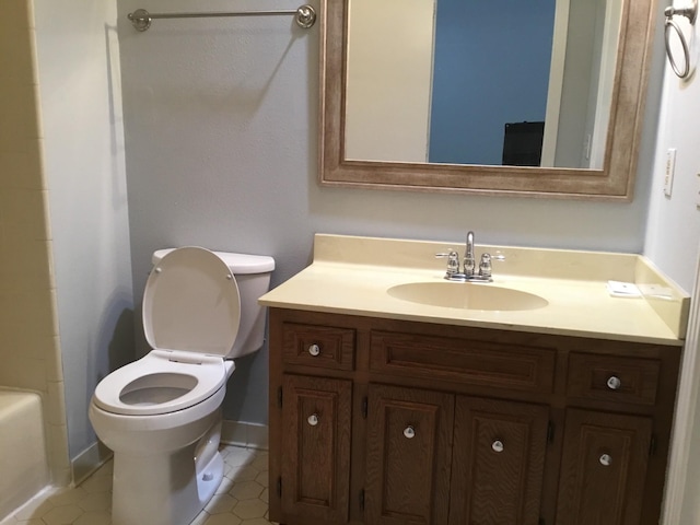 full bathroom with tile patterned floors, vanity, toilet, and independent shower and bath