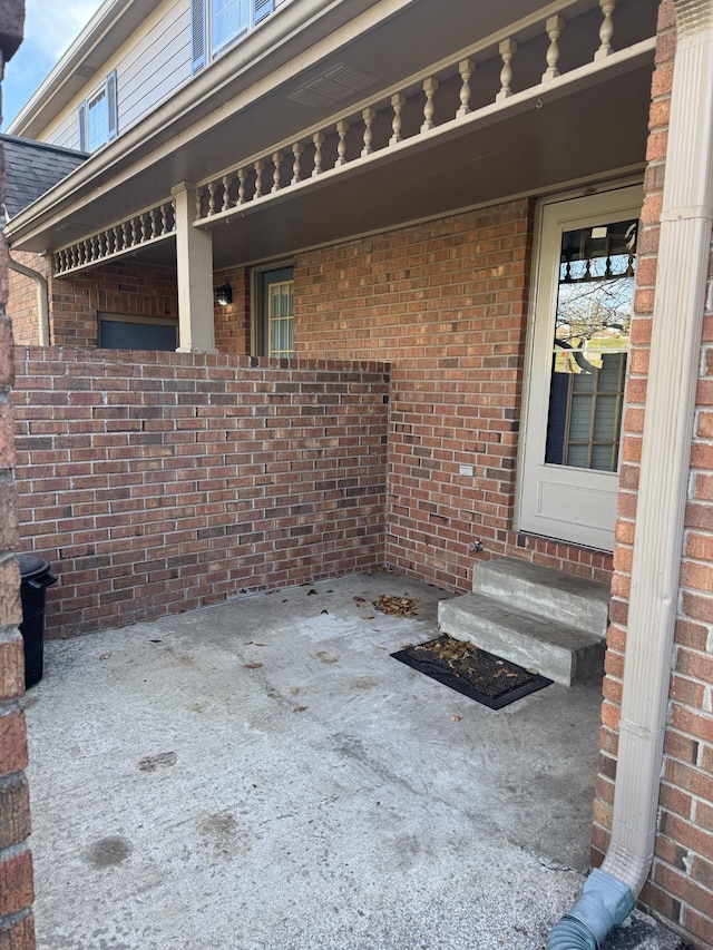 entrance to property with a patio area