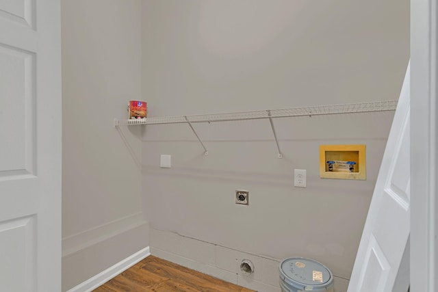 washroom with washer hookup, hookup for an electric dryer, and wood-type flooring