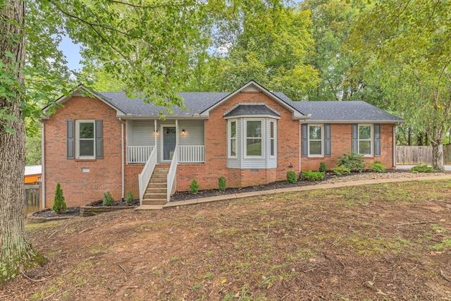 ranch-style home with covered porch