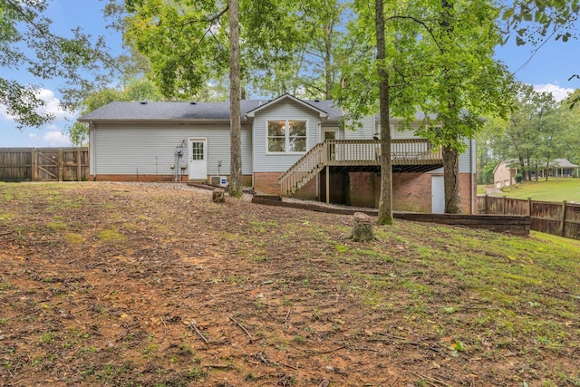 back of property featuring a deck