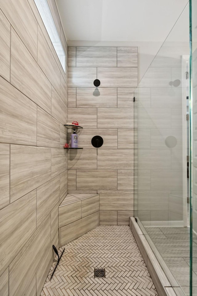 bathroom with a tile shower