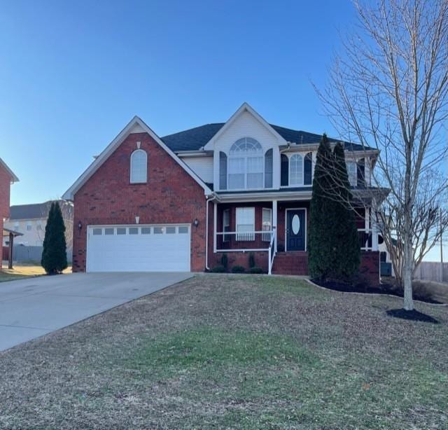 front facade with a garage and covered porch