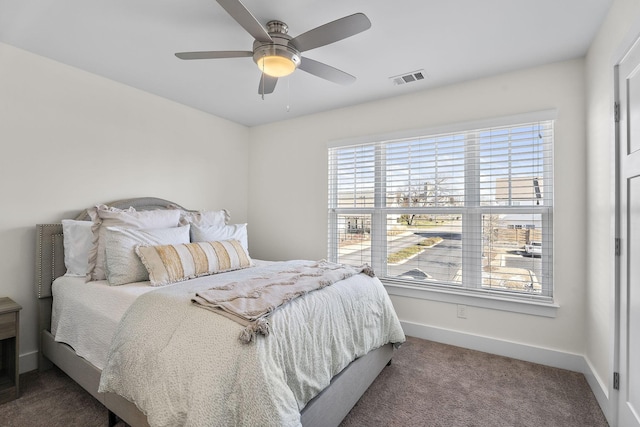 bedroom with ceiling fan and carpet