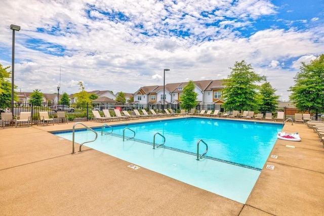 view of swimming pool with a patio