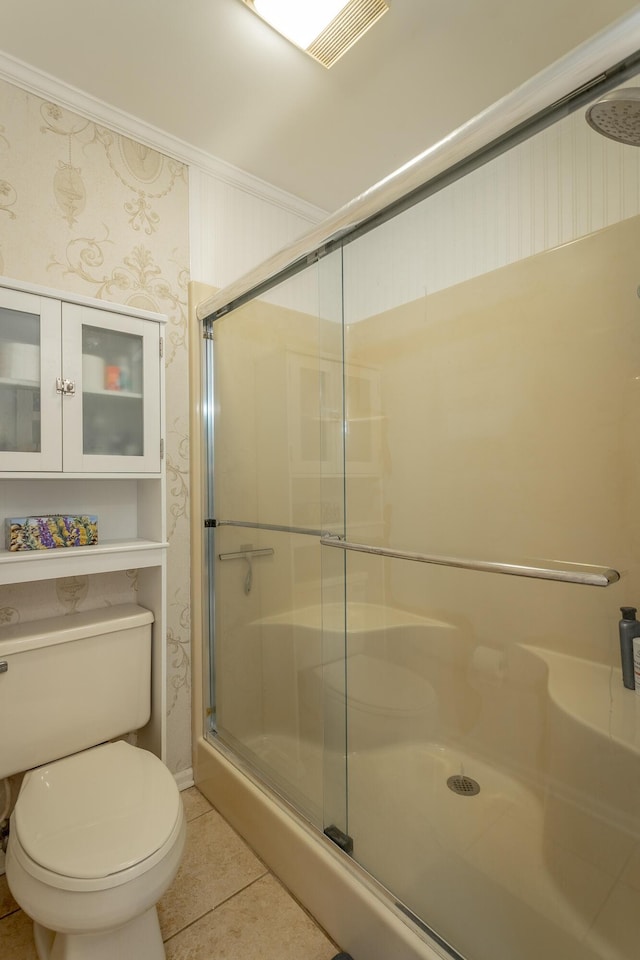 bathroom with an enclosed shower, crown molding, tile patterned floors, and toilet