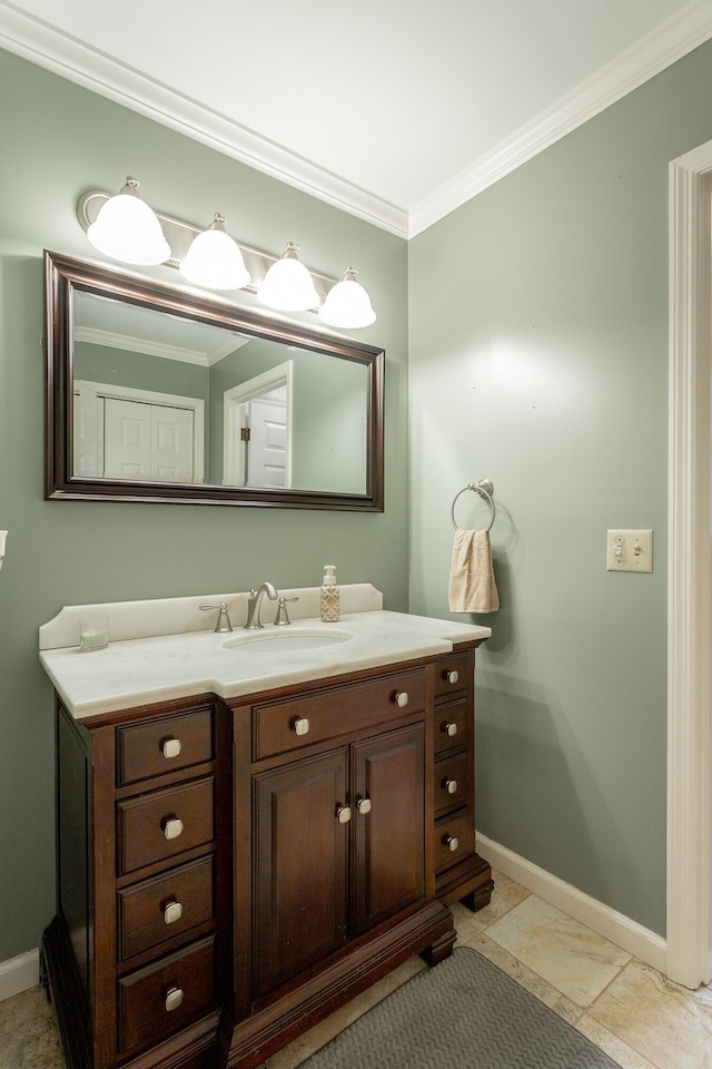 bathroom with crown molding and vanity