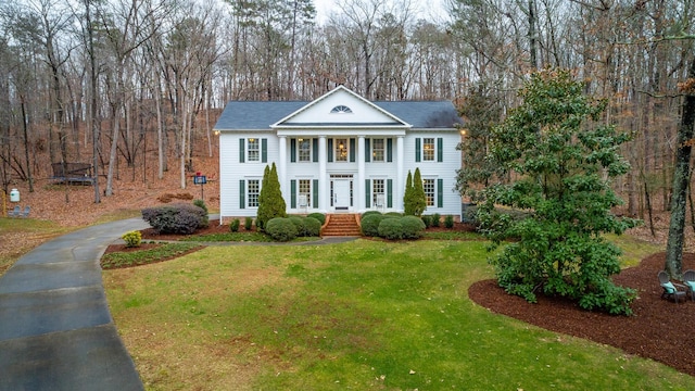 neoclassical / greek revival house with a front yard