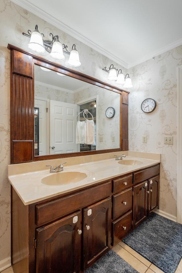 bathroom with ornamental molding, vanity, and tile patterned flooring