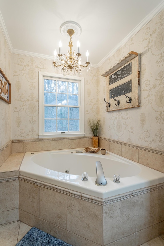 bathroom featuring ornamental molding, tiled bath, and a chandelier