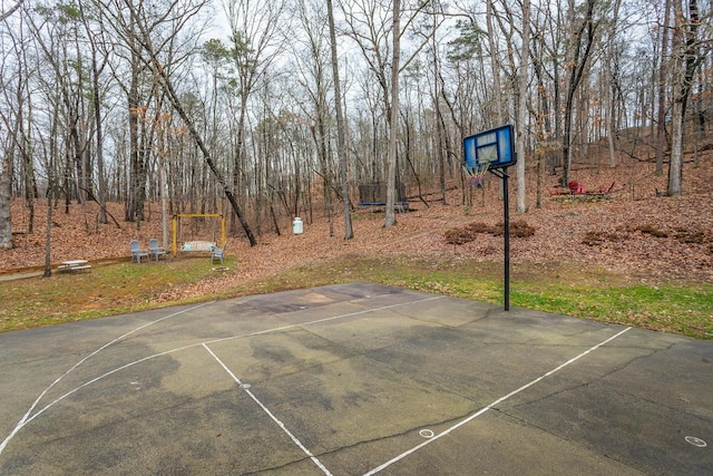 view of sport court featuring a trampoline