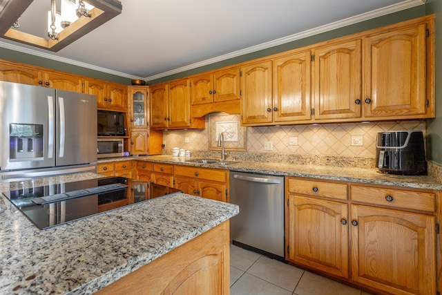 kitchen with light tile patterned flooring, sink, ornamental molding, light stone counters, and black appliances