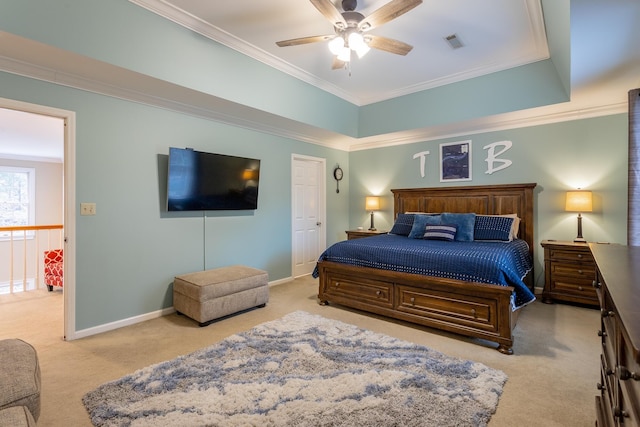 carpeted bedroom featuring crown molding and ceiling fan