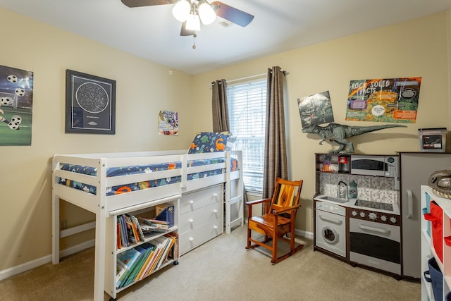 carpeted bedroom with ceiling fan