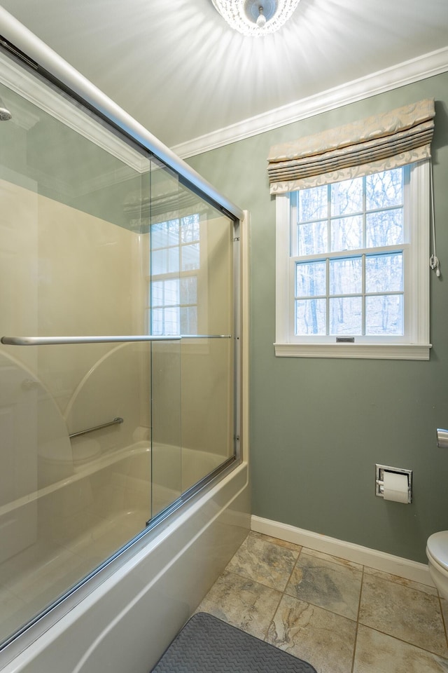 bathroom with crown molding, bath / shower combo with glass door, and toilet