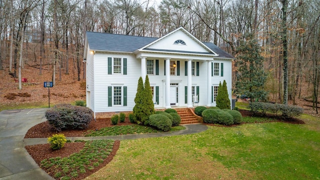 neoclassical / greek revival house with a front yard