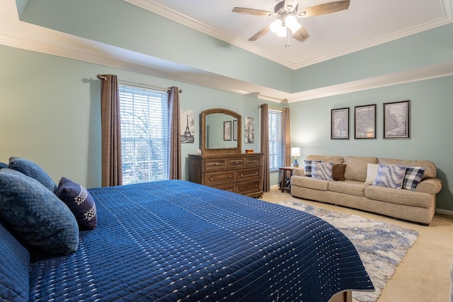 carpeted bedroom featuring ceiling fan and ornamental molding