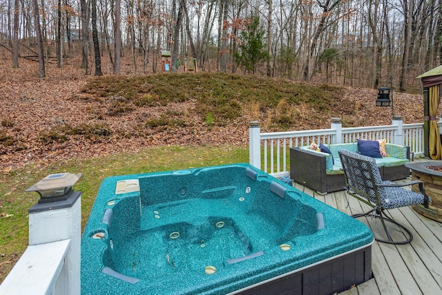 wooden terrace featuring an outdoor hot tub