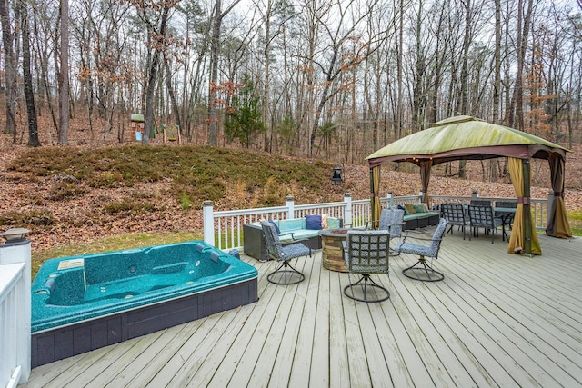 wooden deck featuring a gazebo and an outdoor living space