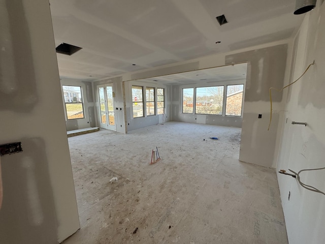 unfurnished living room featuring plenty of natural light