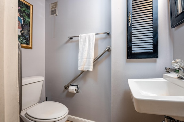 bathroom featuring sink and toilet