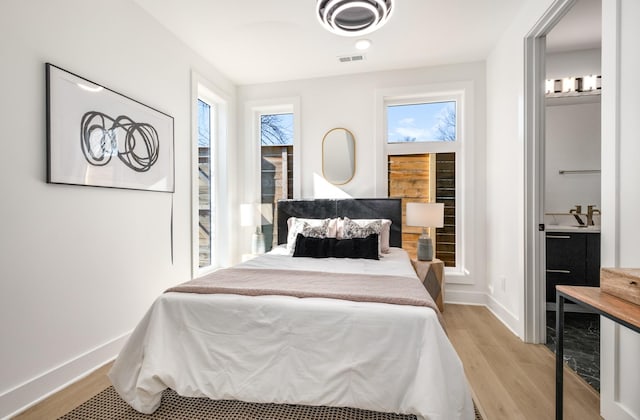 bedroom with light hardwood / wood-style flooring