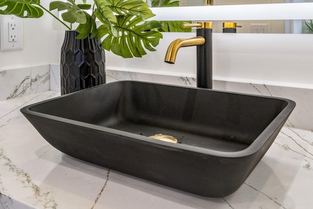 interior details with sink and a tub to relax in