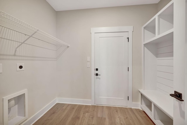 laundry area with light hardwood / wood-style flooring and electric dryer hookup