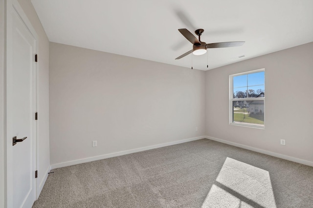 carpeted empty room with ceiling fan