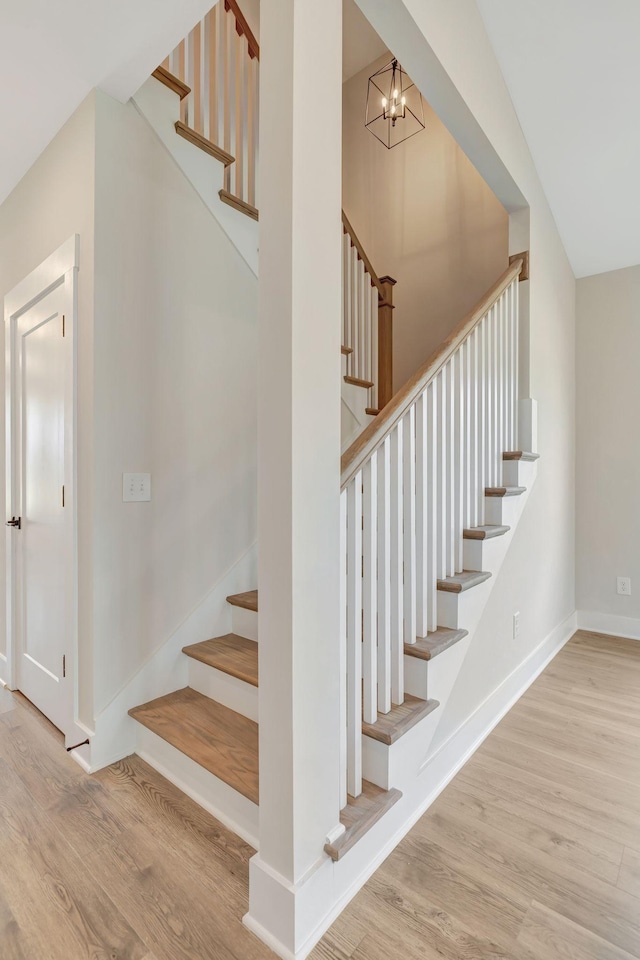 staircase featuring hardwood / wood-style floors