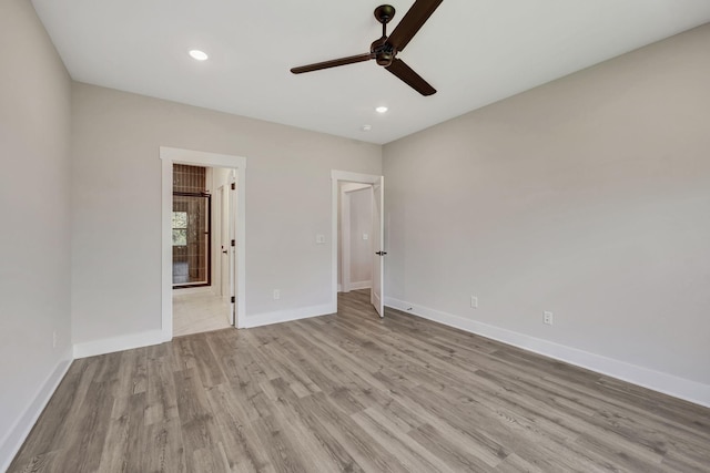 unfurnished bedroom with connected bathroom, ceiling fan, and light wood-type flooring