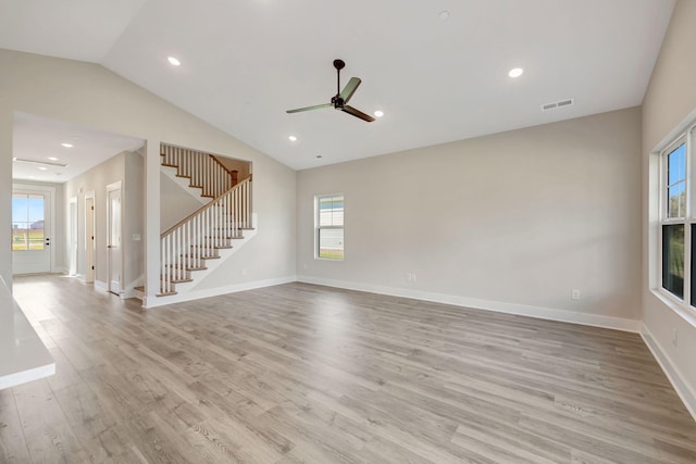 unfurnished living room featuring ceiling fan, lofted ceiling, and light hardwood / wood-style flooring