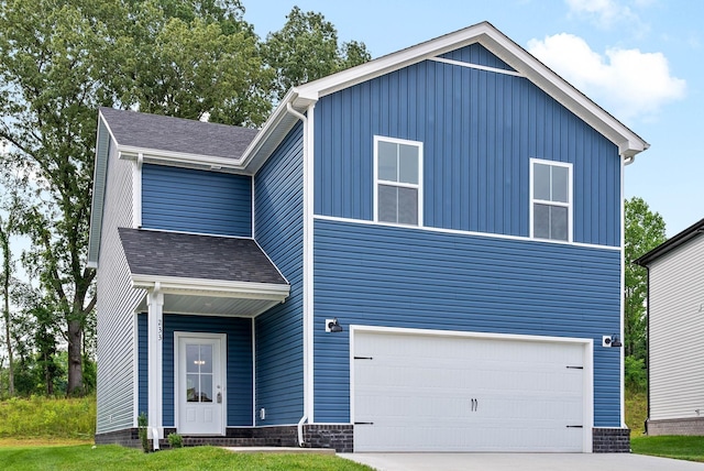 view of front of property featuring a garage