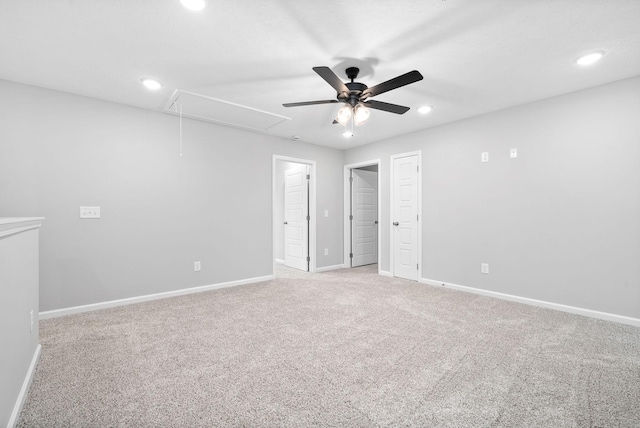 unfurnished bedroom featuring light colored carpet and ceiling fan